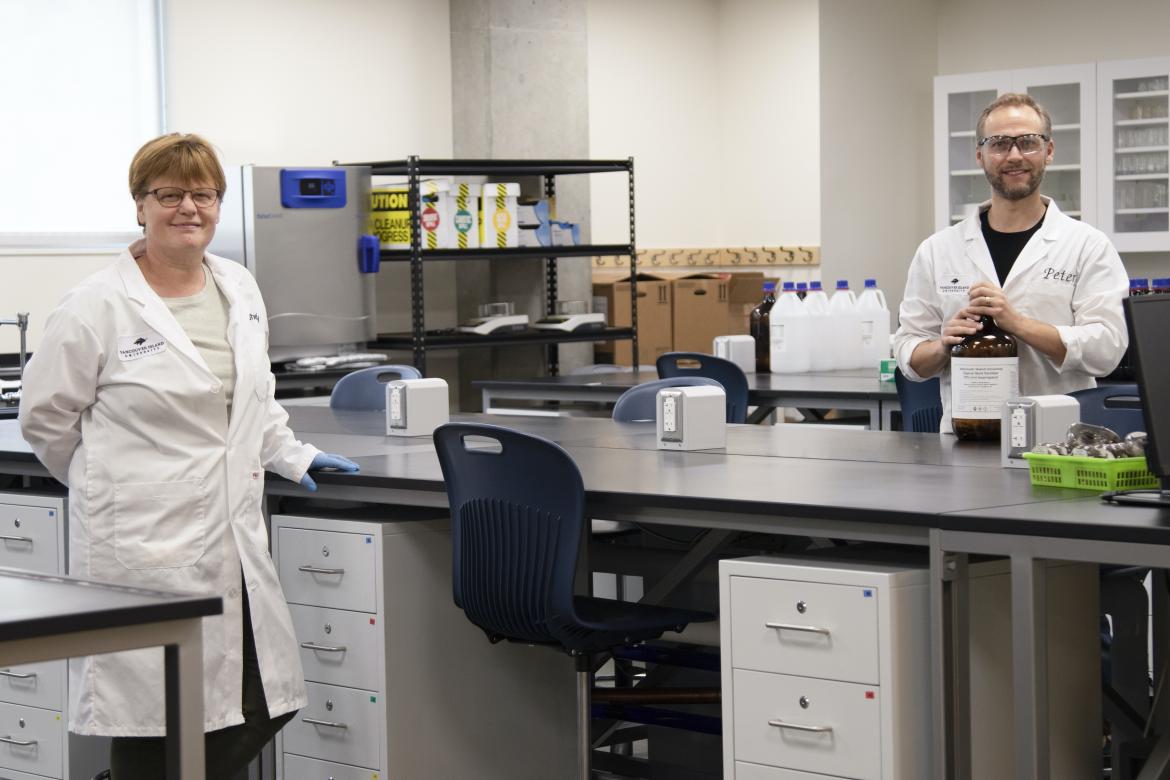 Chemistry Technicians Shelley Gellein and Peter Diamente in the Health Canada Licenced Manufacturing Laboratory VIU Donates Critical Health Supplies During COVID-19 Crisis