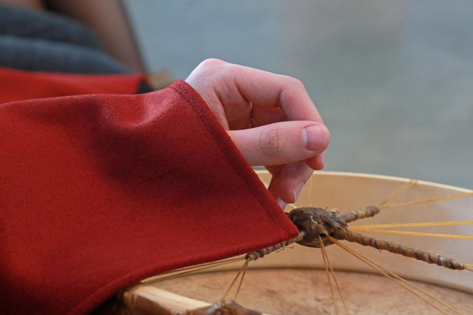 A hand resting on a drum