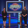 Whitney Wood stands on the Jeopardy! stage with host Mayim Bialik.